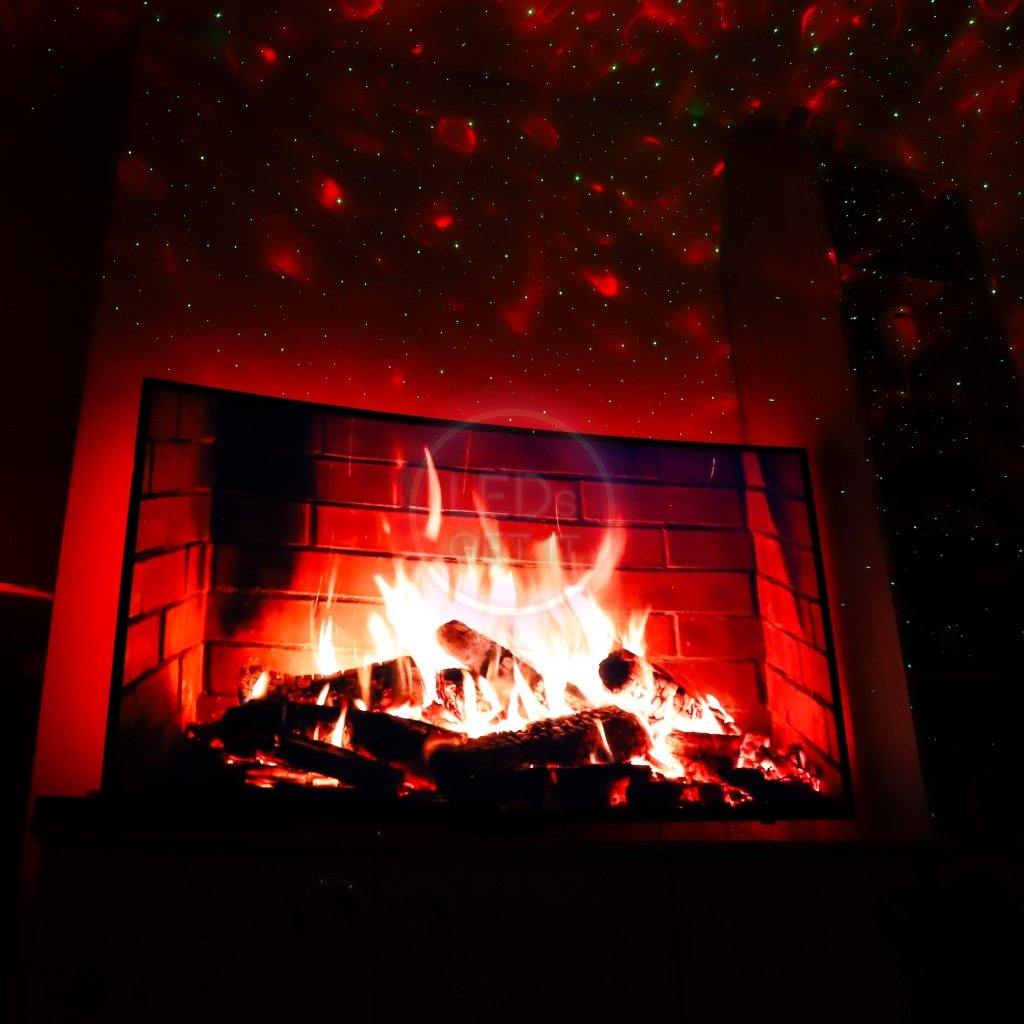 Galaxy Projector with night sky lights on ceiling and cosy fireplace